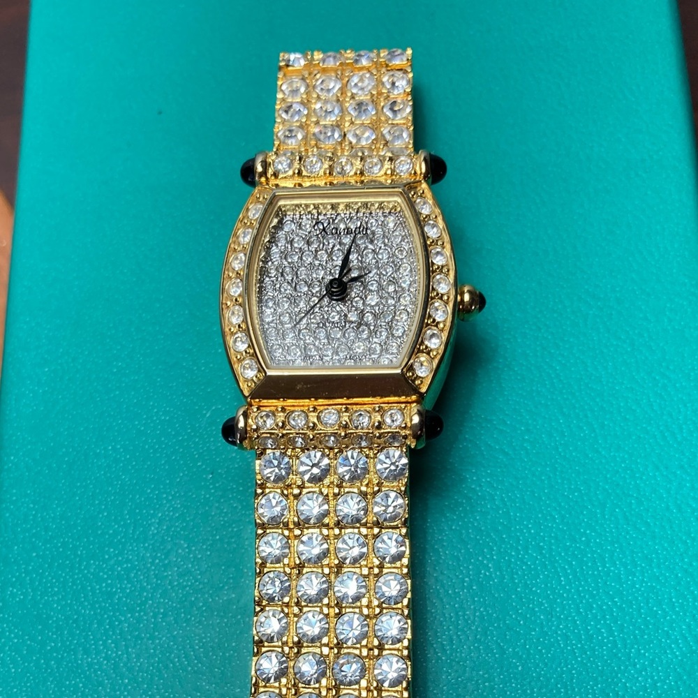 Glam watch with faux diamonds (no one can tell) in a Cartier Tank style case.